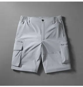 Grey quick-dry cargo shorts for men featuring multiple zipper pockets for outdoor hiking