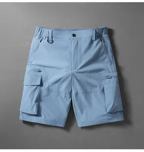 Close-up view of men's quick-dry cargo shorts in light blue featuring multi-zipper pockets
