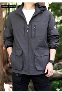 Mid-shot detail of men's dark grey hooded outdoor jacket featuring utility pockets