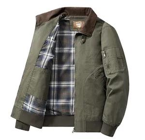 Detailed view of army green cotton bomber jacket with plaid lining and corduroy collar