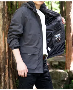 Detail of men's dark grey ripstop outdoor jacket showing mesh lining and inner pocket