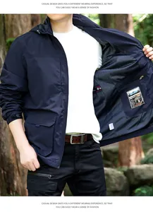 Detailed view of men's navy outdoor jacket showing durable mesh lining and interior pocket.