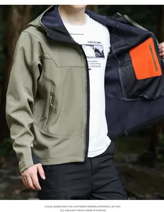 Détail de la veste softshell à capuche pour hommes montrant la doublure et la poche orange