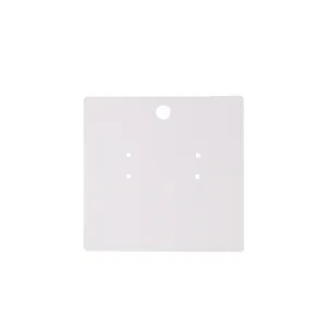 Detailed macro view of a blank square white earring display card with pre-punched hanging holes