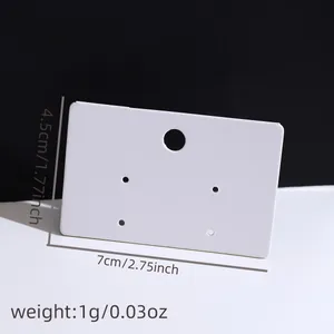 Detailed view of blank white earring display card showing 7x4.5cm size and 1g weight