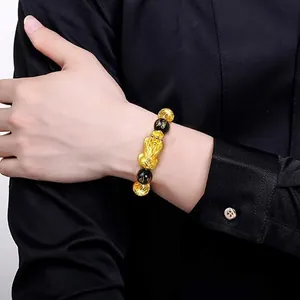 Lucky gold Pixiu bracelet with obsidian beads featuring the Six-character Mantra