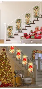 Guirlandes d'escalier de Noël festives avec lumières LED décorant une rampe intérieure.