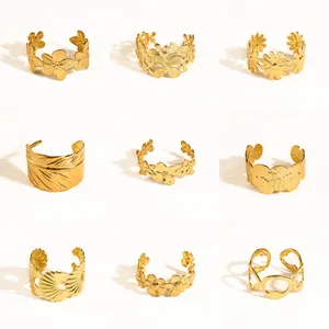 Gedetailleerd overzicht van negen vintage gouden roestvrijstalen armbanden met bloemmotieven