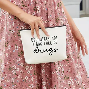 Close-up of a durable cream canvas pouch with humorous definitely not drugs typography