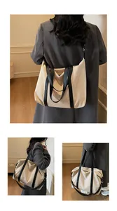 Minimalist canvas tote bag with large capacity for commuting and travel