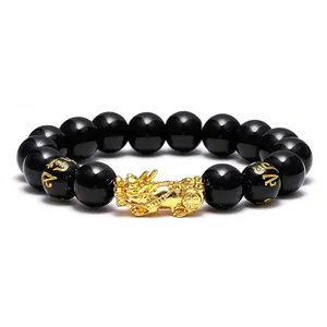 Feng Shui black obsidian bead bracelet featuring a golden PiXiu and mantra symbols
