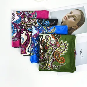 Collection of four colorful paisley satin square scarves for fashion styling