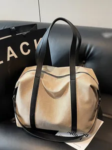 Large capacity vintage canvas tote bag with black leather straps for daily commute.