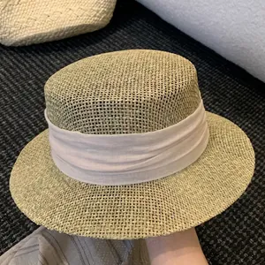 French flat-top straw hat with beige cloth band for summer sun protection