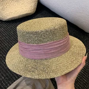 French flat top straw hat with elegant pink fabric band for beach vacation sun protection