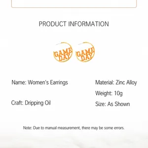 Detailed view of fashionable gold C-shaped hoop earrings with orange enamel Game Day text