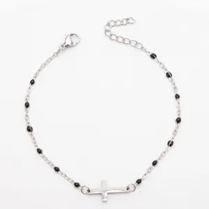 Bracelet croix en acier inoxydable argenté avec perles en émail noir pour femme