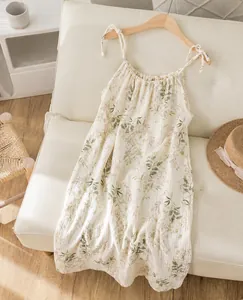 Detailed view of a floral cotton gauze nightdress, featuring delicate summer flower patterns.