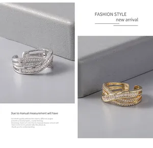 Detail view of gold and silver copper rings with full zircon micro-pave setting