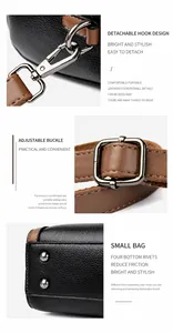 Details einer schwarzen Ledertasche mit abnehmbaren Haken und verstellbarer Schnalle