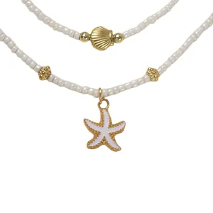 Collar de capas estilo océano con dijes de estrella de mar y concha y perlas blancas
