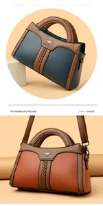 Elegante Damenhandtasche aus geprägtem Leder mit Känguru-Logo und stabilen Griffen