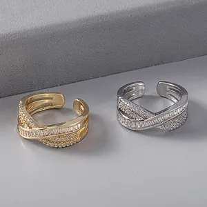 Cross-layered copper ring with sparkling cubic zirconia, 18K gold and silver plated.