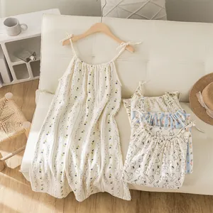 Sweet floral cotton gauze spaghetti strap nightgown shown in a cozy home setting