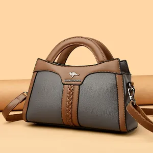 Elegante Handtasche aus grauem und braunem Leder mit Tragegriff und Umhängeriemen