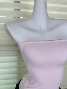 Close-up of pink ribbed elastic tube top showing fabric texture and fit