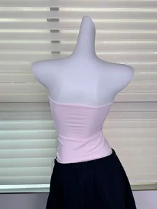 Rear view detail of a pink skin-friendly elastic strapless tube top on a mannequin