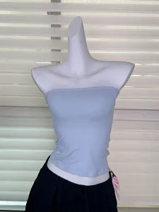 Light blue elastic strapless tube top displayed on a white mannequin with black pants.