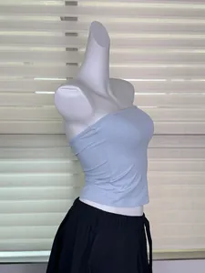 Side detail view of a seamless light blue elastic one-piece tube top on mannequin
