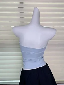 Detailed rear view of light blue elastic tube top on white mannequin with blinds background