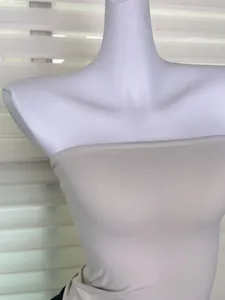 Close-up detail showing the ribbed texture of a beige nude-feel elastic tube top