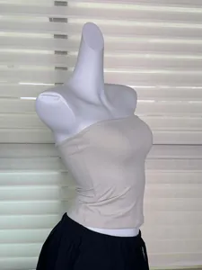 Detailed side view of a light beige elastic strapless tube top on a mannequin torso