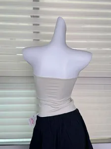 Detailed back view of a beige seamless elastic tube top displayed on a white mannequin