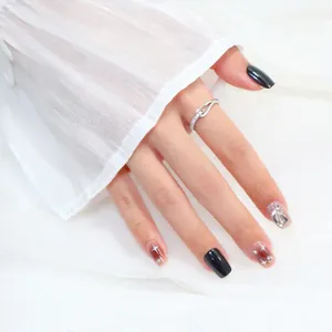 Detailed view of an adjustable silver knotted ring with pavé zircon stones on hand