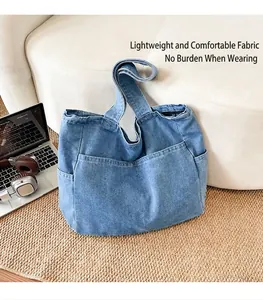 Large capacity blue denim tote bag with multiple pockets in a lifestyle home setting
