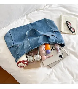 A large capacity denim tote bag lifestyle shot showing ample storage space and contents