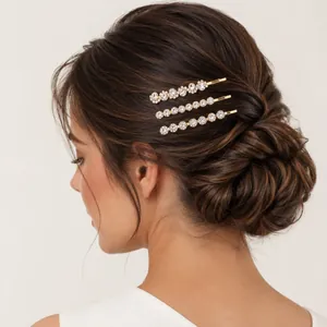 Elegant set of three gold-tone hair clips with sparkling rhinestones for women's updos