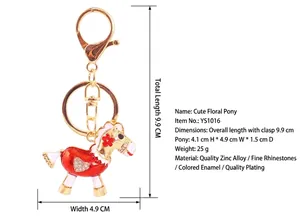 Detailed close-up of a cute red rhinestone pony keychain with full size measurements
