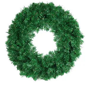 Lush green artificial PVC Christmas wreath for front door wall and holiday home decoration