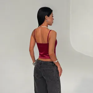 Sexy burgundy satin camisole crop top for women shown from back view perspective