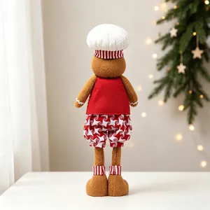 Vue arrière d'une peluche de bonhomme de pain d'épices avec chapeau de chef Noël