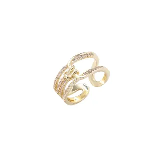 Elegant gold-plated adjustable open ring featuring a lock design and pink rhinestones.