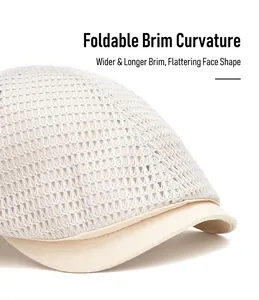 Close-up of beige mesh flat cap showing breathable hollow texture and foldable brim