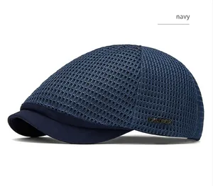 Detailed macro view of a navy blue mesh beret featuring a breathable hollow-out design