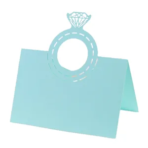 Close-up of light blue laser-cut diamond ring place card for wedding table decoration