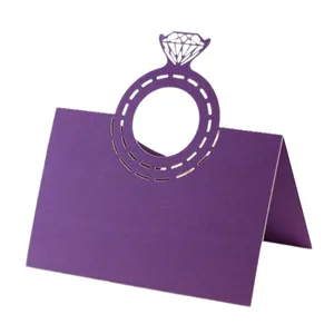 Close-up detail of a purple laser-cut diamond ring place card for elegant weddings
